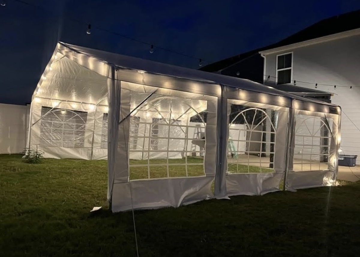 20x20 ft tent set up on a grassy field, perfect for medium gatherings